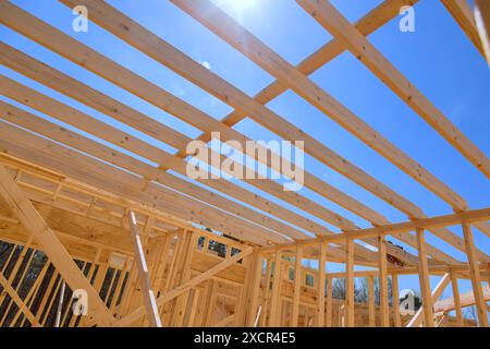 An installation ceiling roof trusses, framework beams, rafters was carried out during construction of new home Stock Photo