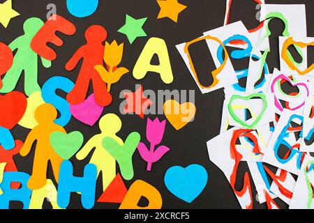 Cutting paper figures with various shapes and colors Stock Photo