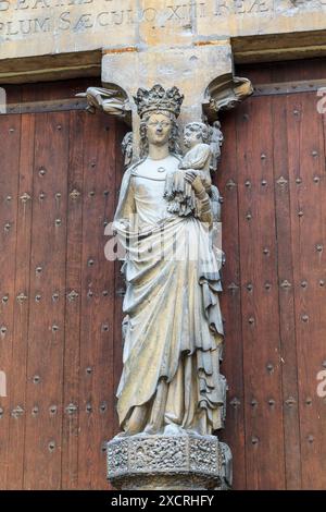 This is the main statue of Our Lady above entrance of Reims Cathedral May 15, 2013 Reims, France. Stock Photo