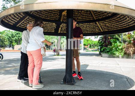 Cali, Colombia - June 17, 2024: Senior tourists at the famous Jairo Varela Square. Senior travel concept. Stock Photo