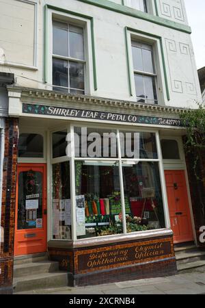 The Shirley Leaf and Petal Co, historic shopfront previously a chemist and optician. Stock Photo