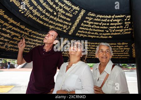 Cali, Colombia - June 17, 2024: Senior tourists at the famous Jairo Varela Square. Senior travel concept. Stock Photo