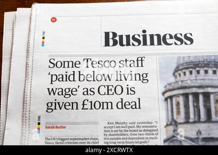 'Some Tesco staff 'paid below living wage' as CEO is given £10m deal' Guardian newspaper headline Business article London UK 15 June 2024 London UK Stock Photo