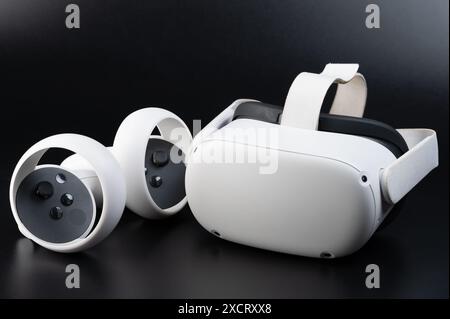 White plastic VR set kit with joystick isolated on black studio background Stock Photo