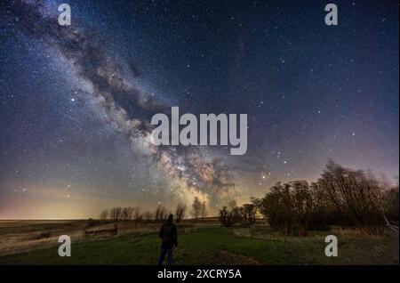 This is a selfie portrait of me under the Milky Way from my backyard in rural Alberta, on a spring night, May 9/10, 2024. The summer Milky Way and the Stock Photo