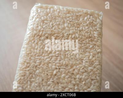 Packaging of rice for making risotto. Vacuum packed to preserve the quality of rice grains. A modern way to store cereals. Rectangular packaging for p Stock Photo