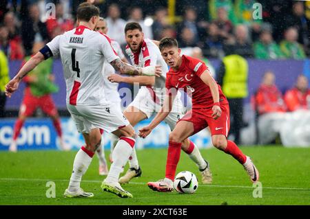 Turkey’s Arda Guler in action against Georgia's Guram Kashia during the UEFA Euro 2024 Group F match at the BVB Stadion Dortmund in Dortmund, Germany. Picture date: Tuesday June 18, 2024. Stock Photo