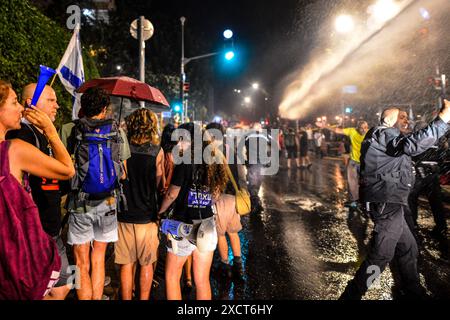 Israel. 18th June, 2024. Thousands demonstrated against Prime Minister Benjamin Netanyahu calling for an Hostage Deal near his Jerusalem residency in Gaza street 35 while setting up bonfires in the street, extinguished by Israeli police water cannons. Jerusalem, Israel. June 17th 2024. (Matan Golan/Sipa USA). Credit: Sipa USA/Alamy Live News Stock Photo