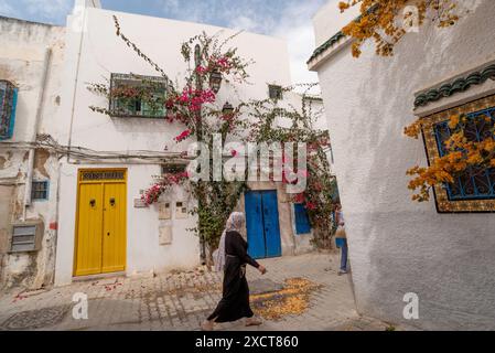 Tunis, Tunisia. 7th May, 2024. Traditional blue and yellow doors of typical Tunisian architecture in the colourful alleyways of the Medina in Tunis. (Credit Image: © John Wreford/SOPA Images via ZUMA Press Wire) EDITORIAL USAGE ONLY! Not for Commercial USAGE! Stock Photo