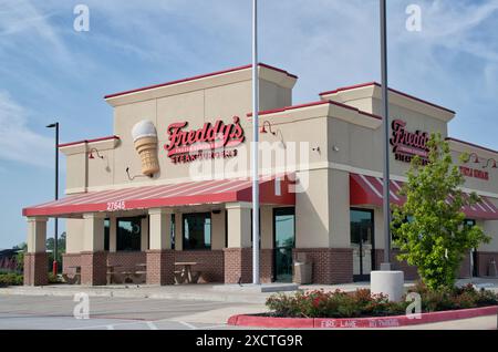 Tomball, Texas USA 04-07-2024: Freddys frozen custard and steakburgers restaurant exterior company business storefront. Stock Photo