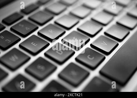 Detailed Close-Up View of a Modern Laptop Keyboard with Focus on the Keys, keyboard used by hackers to attack critical infrastructucture Stock Photo