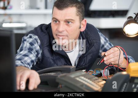 computer service diagnostics using a voltmeter Stock Photo