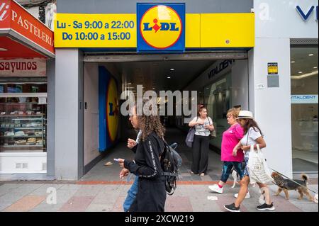 Pedestrians Walk Past The German International Discount Retail Chain 