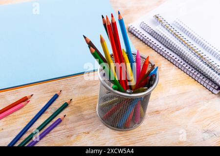 Colored pencils kept in pencil holder Stock Photo