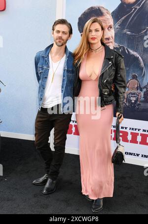 HOLLYWOOD, CALIFORNIA - JUNE 17: (L-R) Tom Payne and Jennifer Åkerman attend the Los Angeles premiere of Focus Features 'The Bikeriders' at TCL Chines Stock Photo