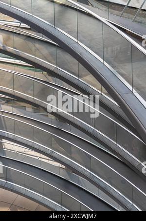 Berlin, Germany - Dec 20, 2023 - A curved walkway stretches in spirals upwards on top inside the glass dome constructed of the Reichstag building. Con Stock Photo