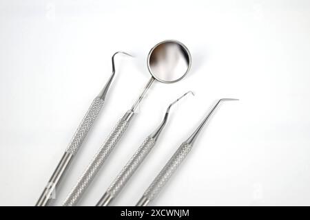 Dental tools on white background – Wales, UK Stock Photo