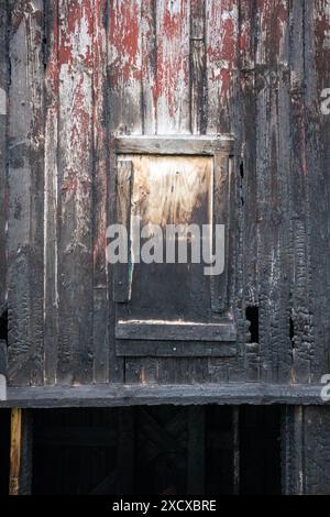 detail of a burnt wooden building wall Stock Photo