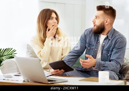 Young Couple Managing Family Budget, Calculating Expenses Stock Photo