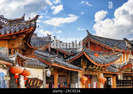 Lijiang, Yunnan Province, China - October 23, 2015: View of traditional Chinese black tile roofs of authentic houses in the Old Town of Lijiang. Stock Photo