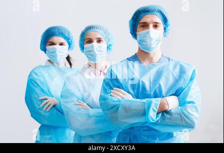 Surgeons Team Ready for Surgery. Practitioners Wearing Protective Uniforms Stock Photo