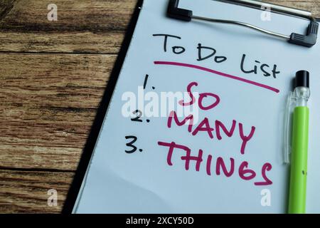 Concept of To do List - So Many Things write on paperwork isolated on wooden background. Stock Photo