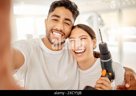 Couple, portrait and selfie with tools for home renovation for improvement of new apartment, happy and construction. Man, woman and photography in new Stock Photo