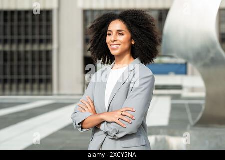 Confident Black Business Woman Entrepreneur Standing Outdoors in a Modern City Stock Photo