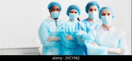 Surgeons Team Wearing Protective Uniforms, Standing In Row Stock Photo