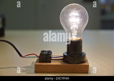 Incandescent lamp. Laboratory tests. Manufacture of electrical equipment. Stock Photo