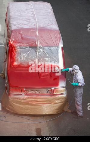 Painting with paint spray gun Stock Photo