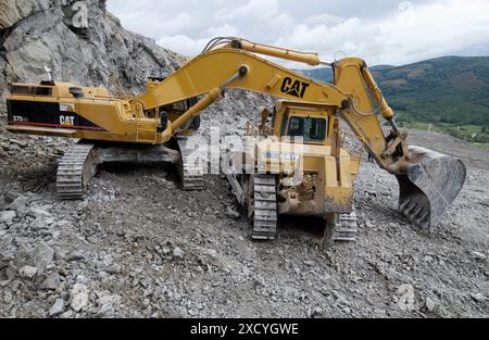 Extracting raw material from quarry for cement manufacturing Stock Photo