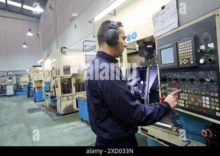 Technician CNC control. Area automated CNC lathes. Machined Indecober. Machining of precision parts in series. Automotive industry. Berriz. Bizkaia. B Stock Photo