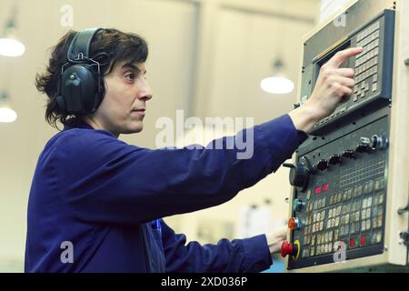 Technician CNC control. Area automated CNC lathes. Machined Indecober. Machining of precision parts in series. Automotive industry. Berriz. Bizkaia. B Stock Photo