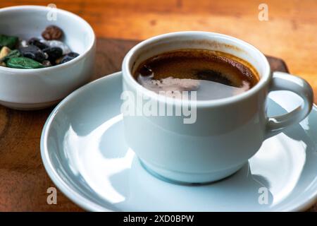 A detailed macro photo of Turkish coffee, showcasing its rich texture, intricate foam, and deep, aromatic essence. Stock Photo