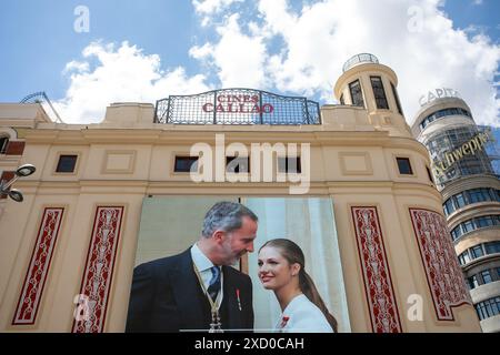 Madrid, Spain. 19th June, 2024.  A portrait of King Felipe VI with his daughter, Princess Leonor, hangs on the facade of the Callao Cinemas in Madrid. Credit: D. Canales Carvajal/Alamy Live News Stock Photo