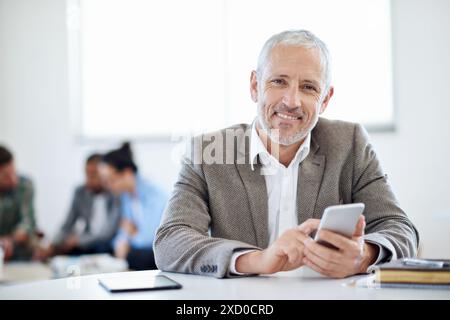 Mature businessman, portrait smile and phone for internet research, social media and reading email in office. Senior guy, ceo and mobile app with Stock Photo