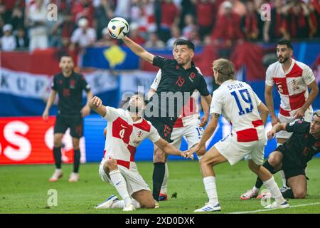 Hamburg, Germany. 19th June, 2024. Mirlind Daku (19) of Albania and Josko Gvardiol (4) of Croatia seen during the UEFA Euro 2024 match in Group B between Croatia and the Albania at Volksparkstadion in Hamburg. Credit: Gonzales Photo/Alamy Live News Stock Photo