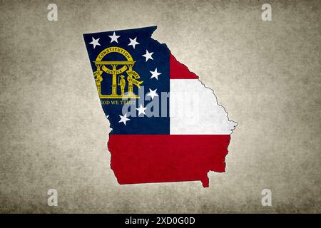 Grunge map of the state of Georgia (USA) with its flag printed within its border on an old paper. Stock Photo