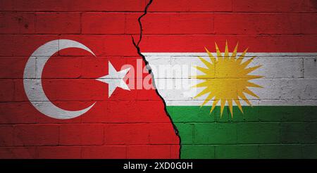Cracked cinder block wall painted with a Turkish flag on the left and a Kurdish flag on the right. Stock Photo