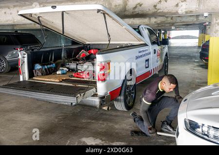 Miami Beach Florida,AAA American Automobile Association,emergency service,Hispanic Latin Latino Hispanics Latins Latinos,ethnic ethnicity,immigrant im Stock Photo