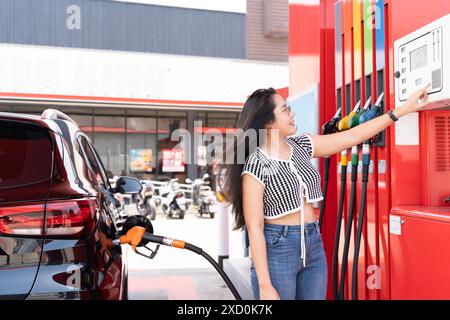 Lady Filling Up Car With Fuel at Modern Gas Station Stock Photo - Alamy