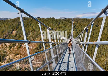 Skybridge 721 suspension footbridge, man walking through Stock Photo