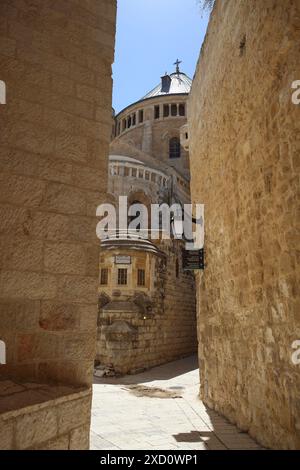 Benedictine Church of Dormition on Mt. Zion built in 1906 where Virgin Mary fell asleep for ever as seen through an alley, Jerusalem, Israel. Stock Photo