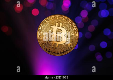 Glowing Bitcoin cryptocurrency against the background of fiber optic cables. Bitcoin digital cryptocurrency consisting of dots and lines, cryptocurren Stock Photo