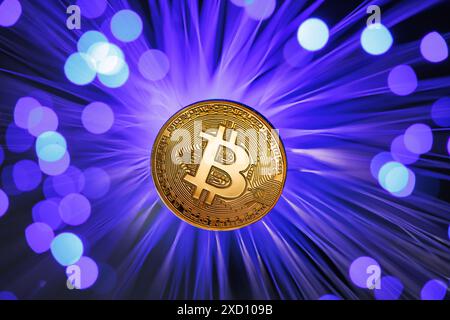 Glowing Bitcoin cryptocurrency against the background of fiber optic cables. Bitcoin digital cryptocurrency consisting of dots and lines, cryptocurren Stock Photo