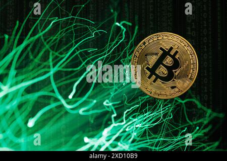Glowing Bitcoin cryptocurrency against the background of fiber optic cables. Bitcoin digital cryptocurrency consisting of dots and lines, cryptocurren Stock Photo
