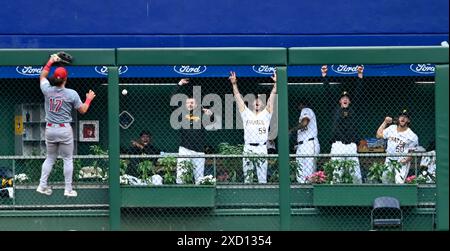 Pittsburgh, United States. 19th June, 2024. Cincinnati Reds outfielder Stuart Fairchild (17) climbs the fence as the Pittsburgh Pirates bullpen celebrates the home run by Pittsburgh Pirates outfielder Bryan Reynolds in the eighth inning of the Pirates 1-0 win at PNC Park on Wednesday June 19, 2024 in Pittsburgh. Photo by Archie Carpenter/UPI Credit: UPI/Alamy Live News Stock Photo