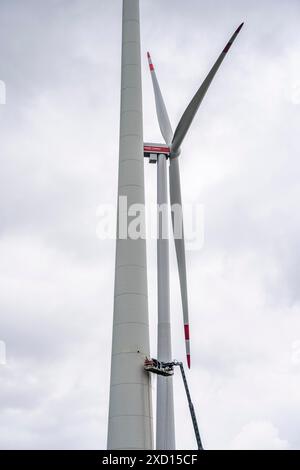 Demolished tower of a 20 year old wind turbine, in the Werl wind farm ...