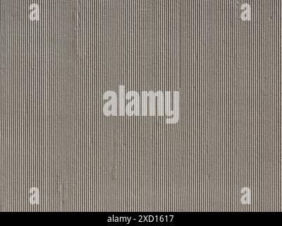 Striated concrete texture of a house facade. Lines structure as design element on a building. Full frame background in grey color as wall plaster. Stock Photo